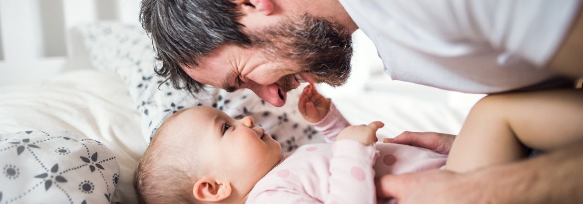 Father playing with toddler