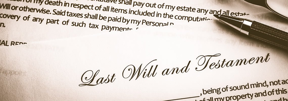 Paper reading last will and testament with pen on top