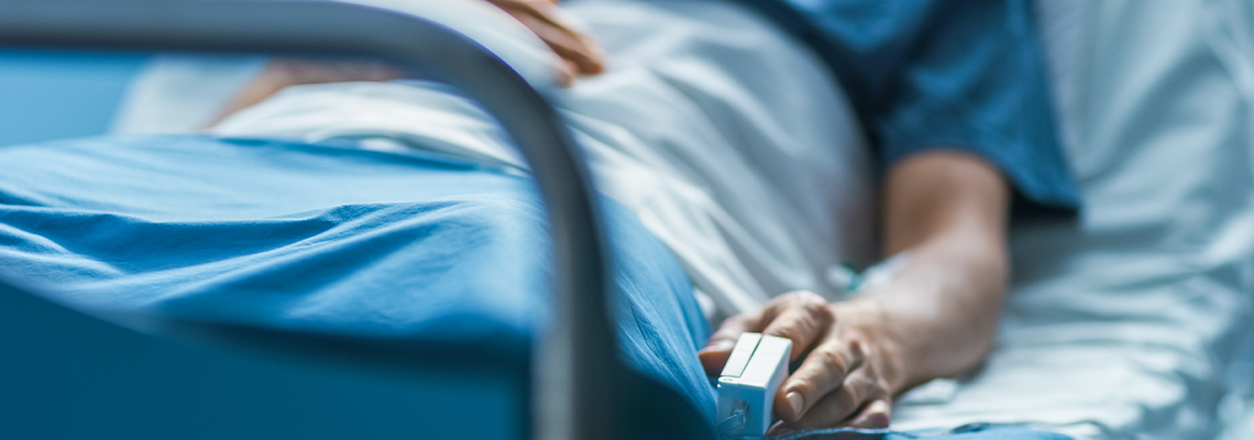 Cancer patient resting on hospital bed
