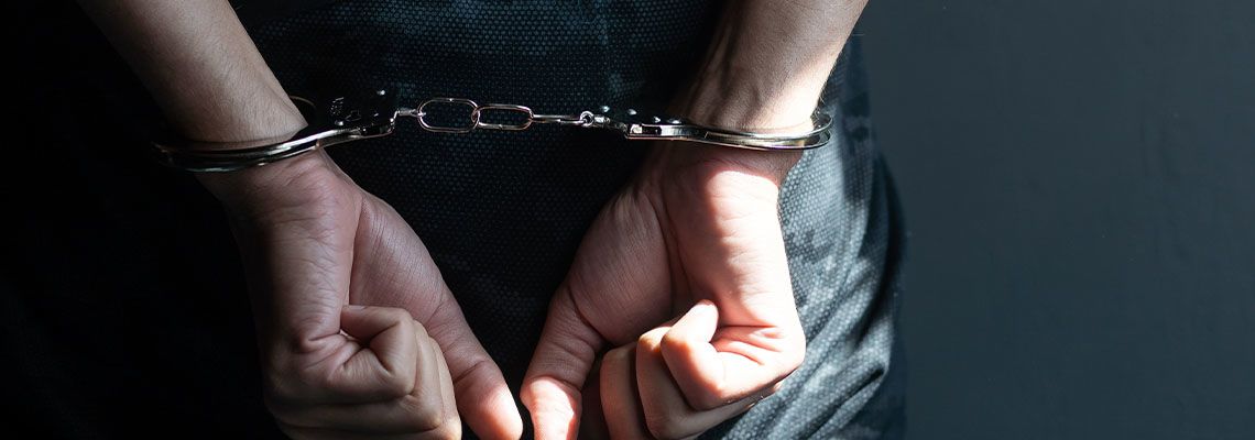 Handcuffed hands of a prisoner