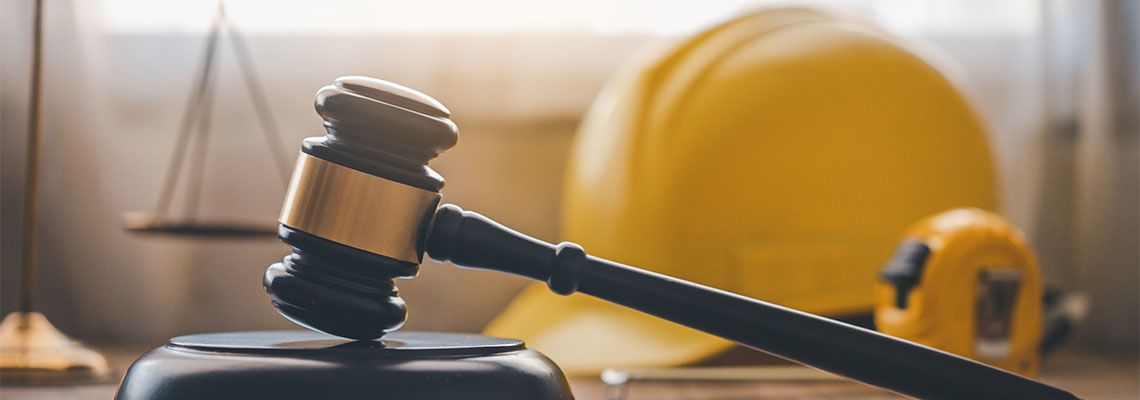 Judge's hammer and construction helmet