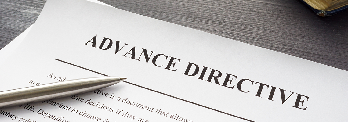 Medical Advance directive form and book with glasses