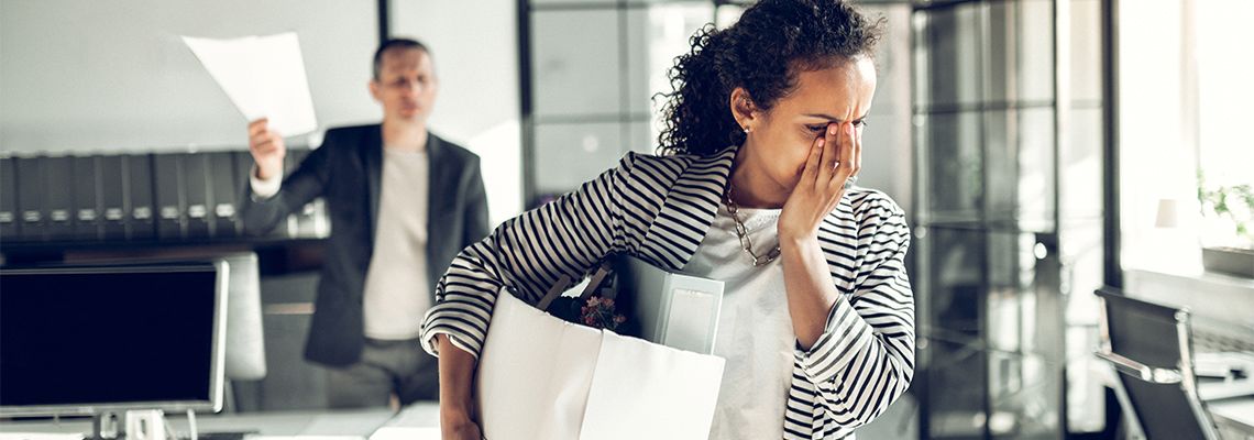 Sad women with her belongings after being terminated