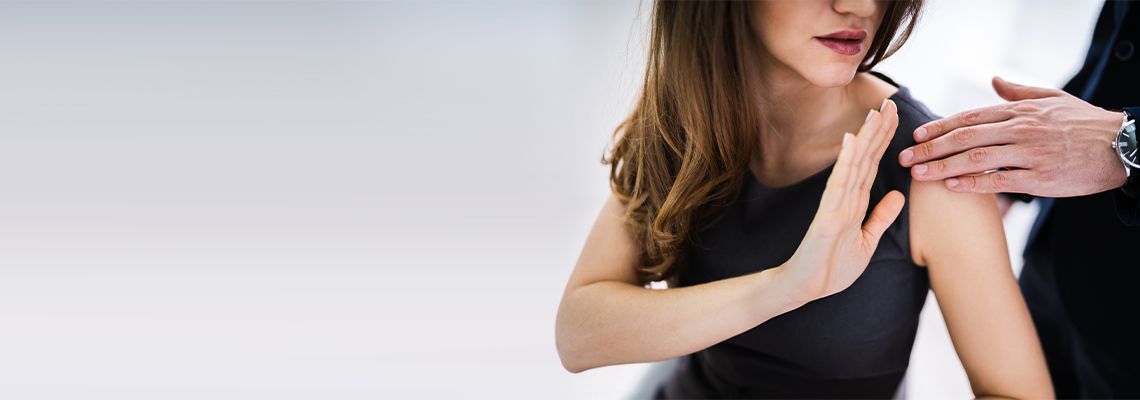 Women defending herself from sexual harassment at office