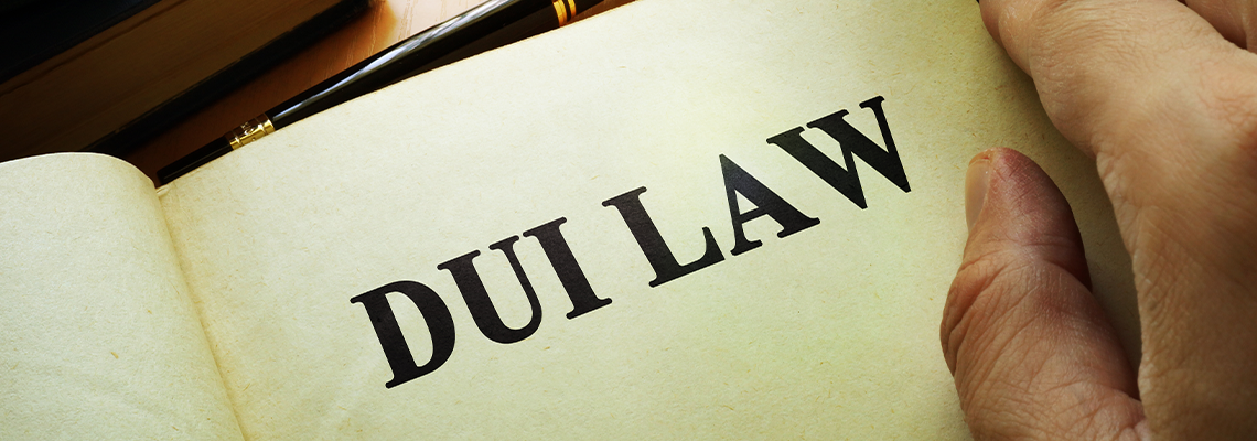 Person opening DUI law book