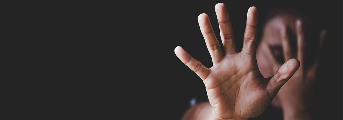 Women showing hand to stop sexual violence