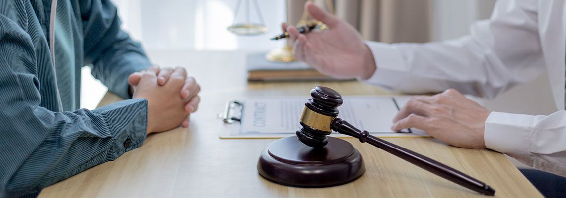 Client consulting with attorney