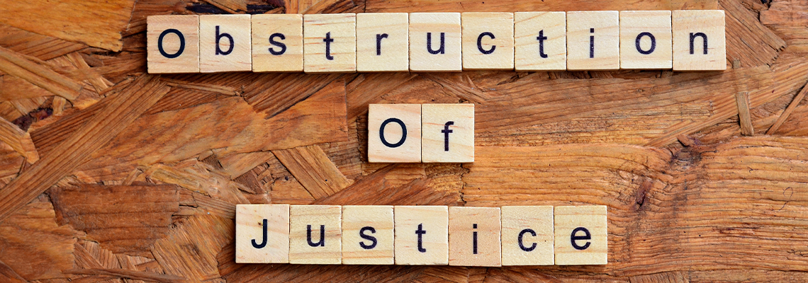 Obstruction of justice text om wooden square, law quotes