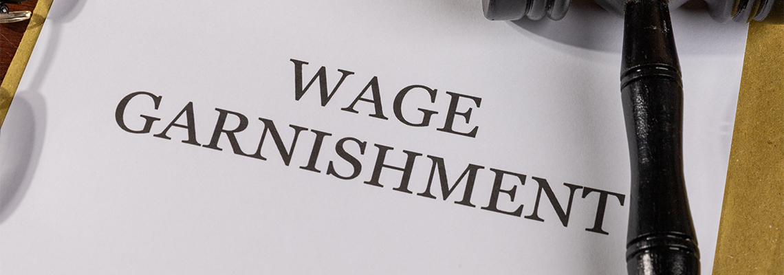 Wage Garnishment Title on Legal Documents Set on Desk