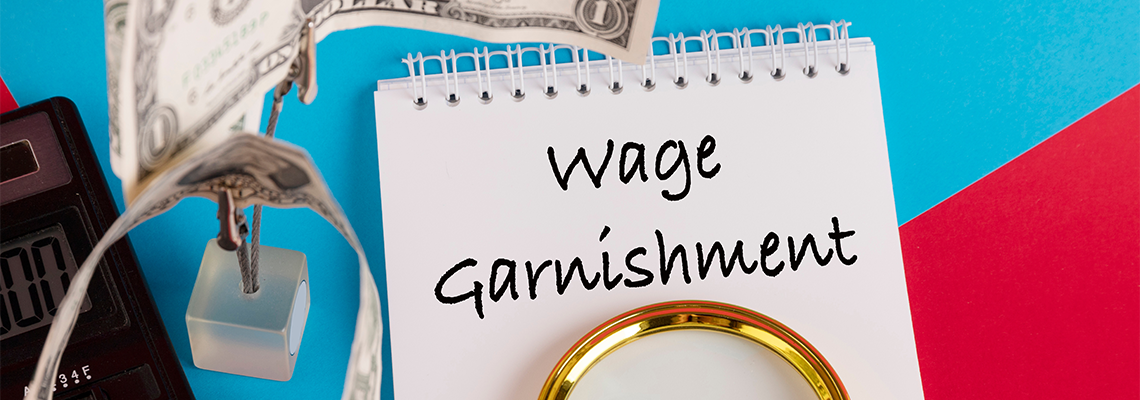 Paper with Wage Garnishment on a table