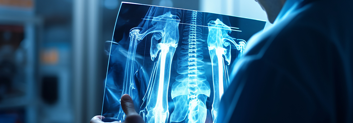 Orthopedic surgeon doctor examining patient's knee joint x-ray films