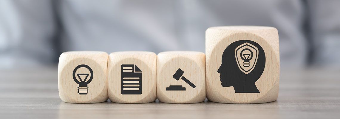 Wooden blocks with icons related to Intellectual Property