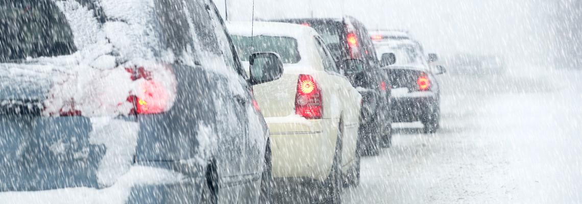 winter roads with cars in a line