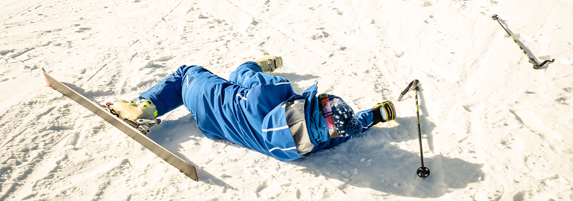 Professional skier after crash accident on skiing resort slope