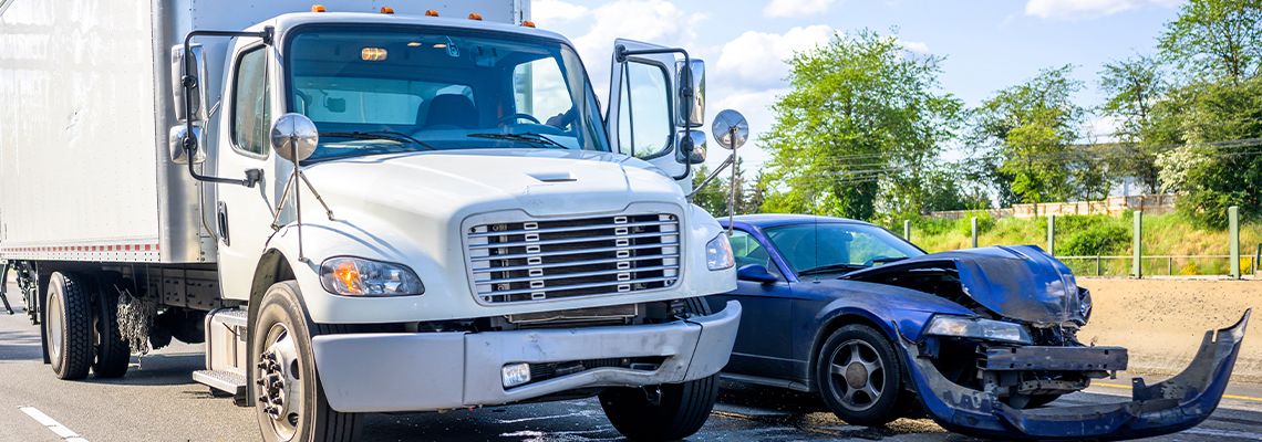 Semi-Truck collides with car at road