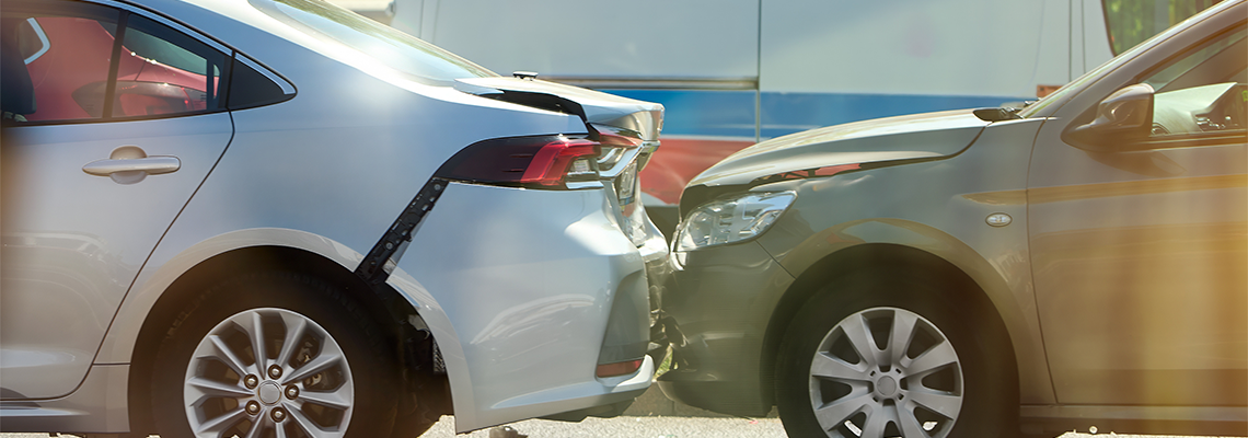 Two cars involved in a rear-end collision at the road