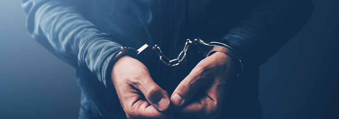 Arrested Drug Criminal with Handcuffs
