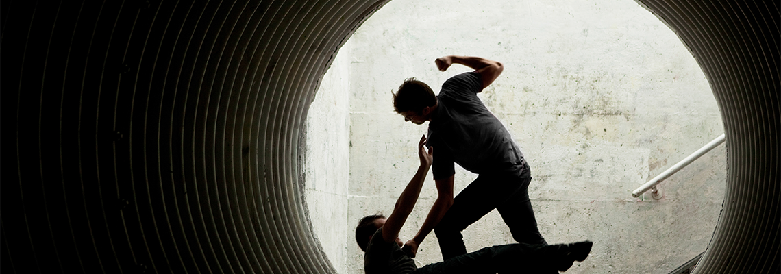 Young People Fighting in A Dark Tunnel