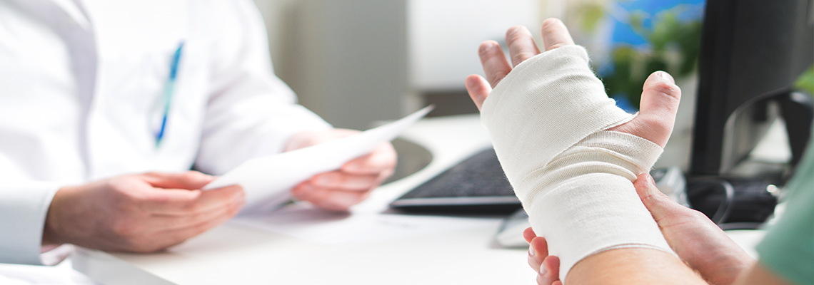 Injured patient showing doctor broken wrist.