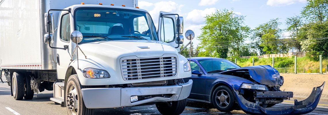 Collision between a semi truck and a car