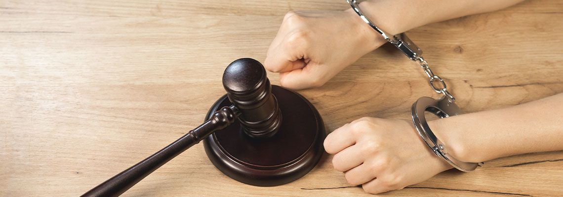 Handcuffed man and gavel