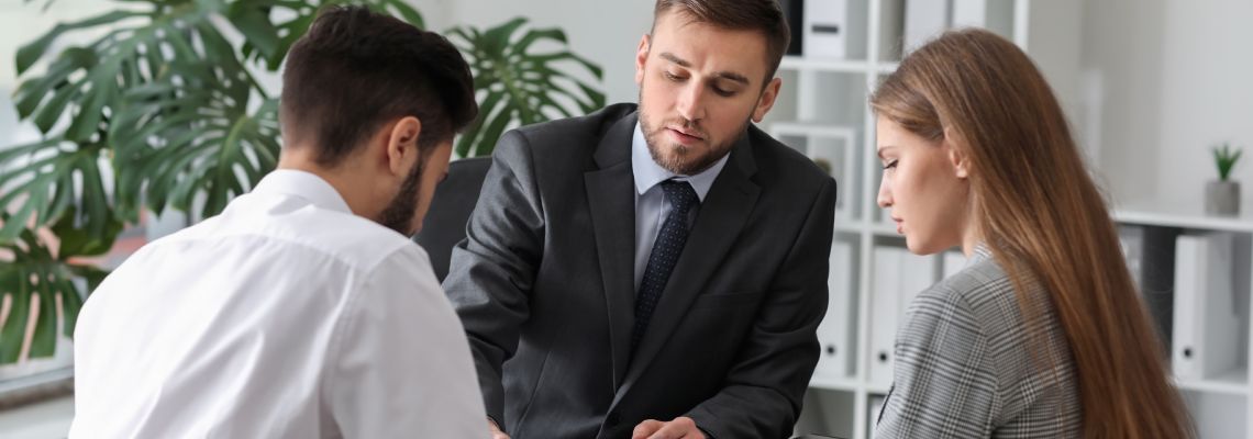 Couples consulting with divorce attorney