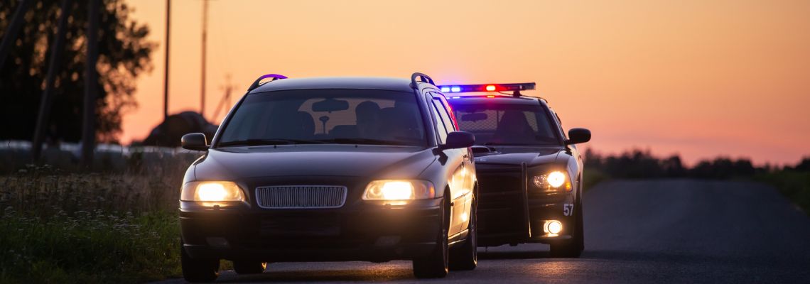 Police pulling over a car