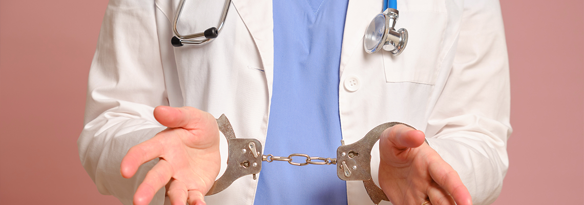 Nurse with hands handcuffed during arrest