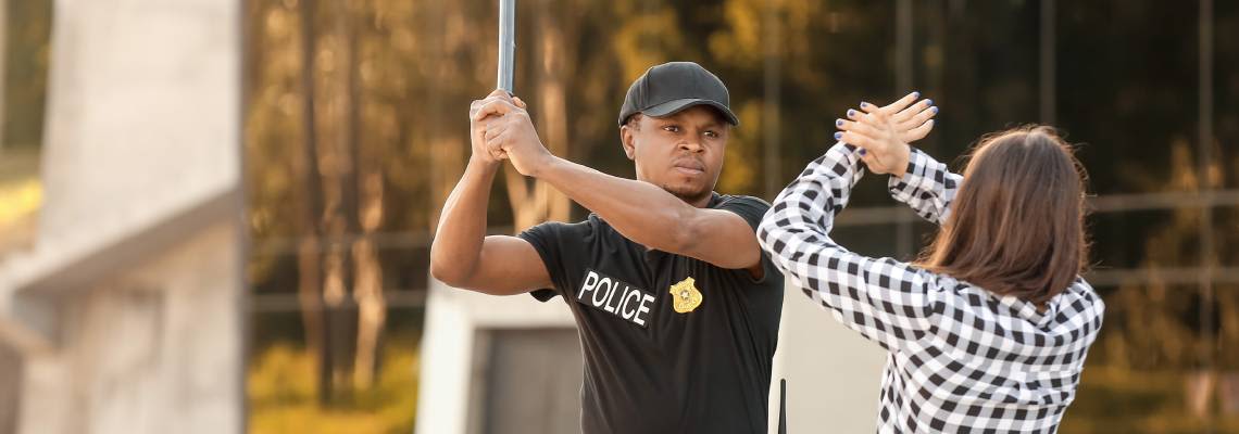 Aggressive police officer mistreating a woman outdoors