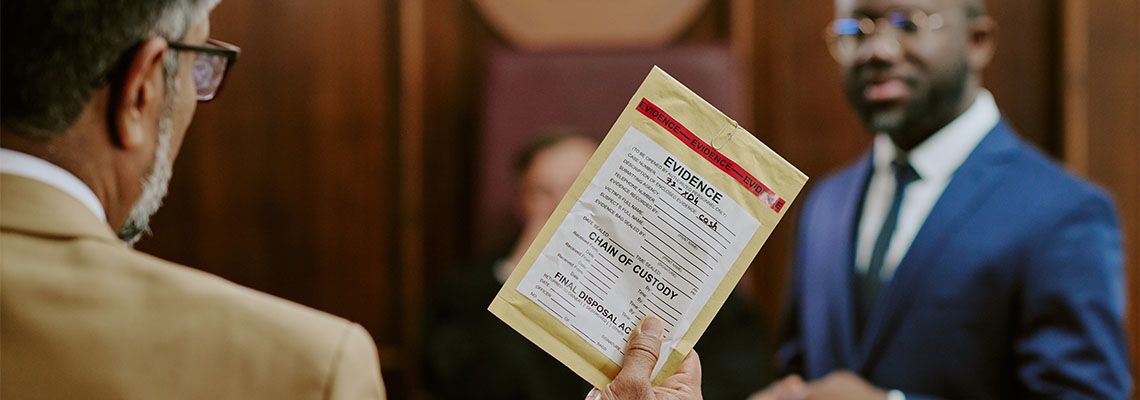 Man holding evidence bag in courtroom
