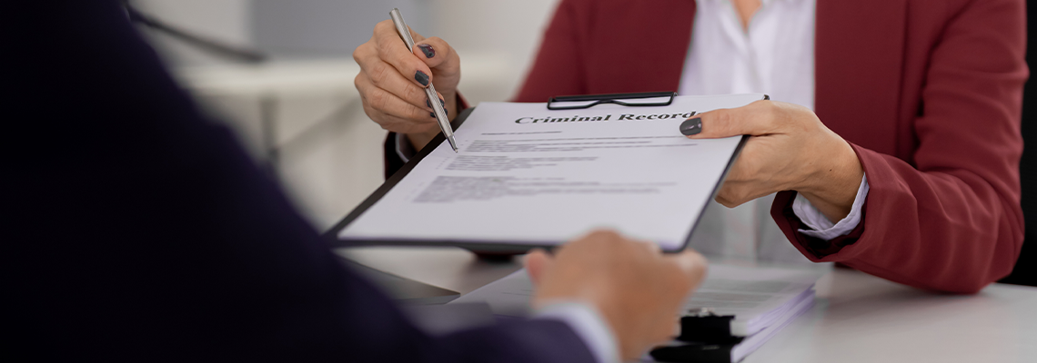 Experienced lawyer adult giving criminal record legal document client at law office