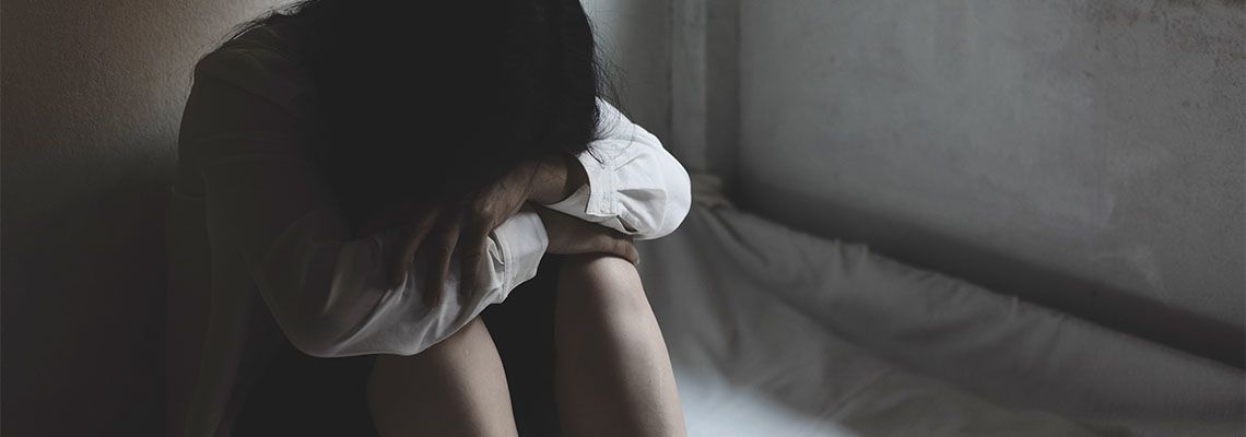 Women crying in corner, sexual violation concept