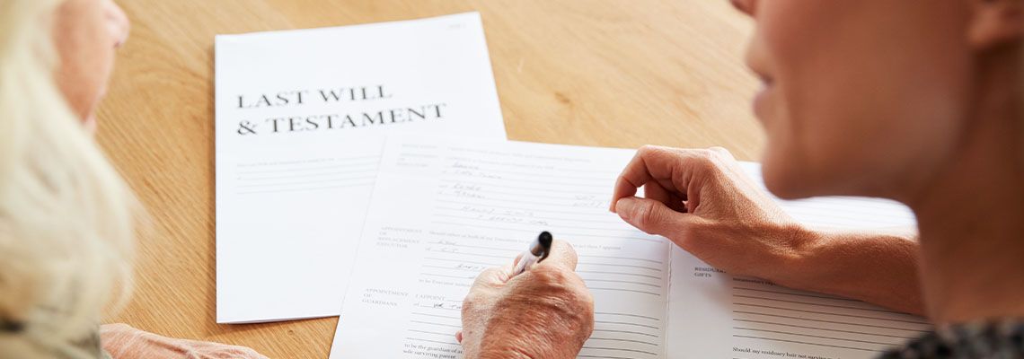 Middle aged female influencing old women while preparing last will