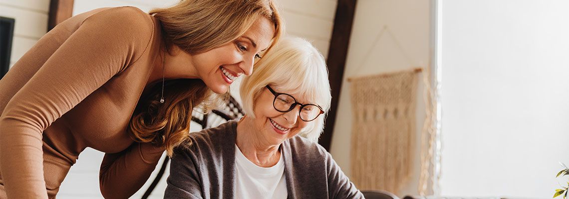Senior women prepare estate plan with help of her caregiver