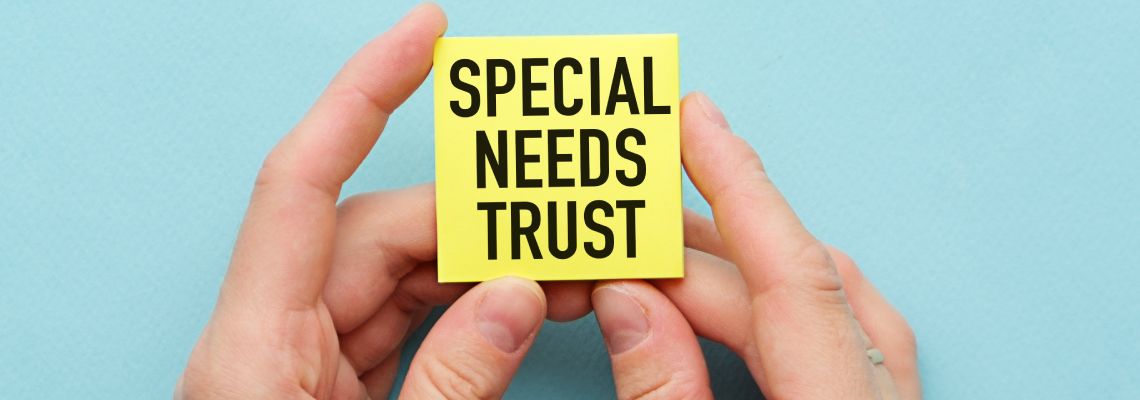 Man holding note with words Special Needs Trust