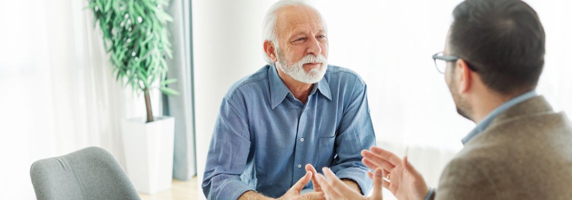 Old man consulting with attorney