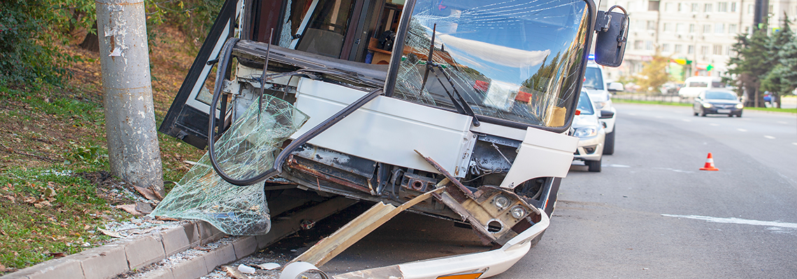 Front of city bus totaled after an accident