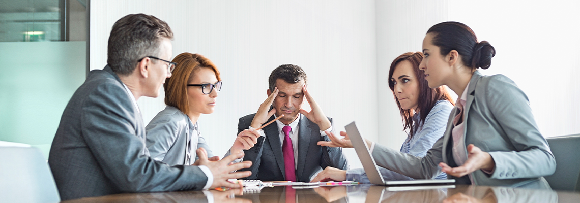 Businesspeople Arguing in Meeting About Trade