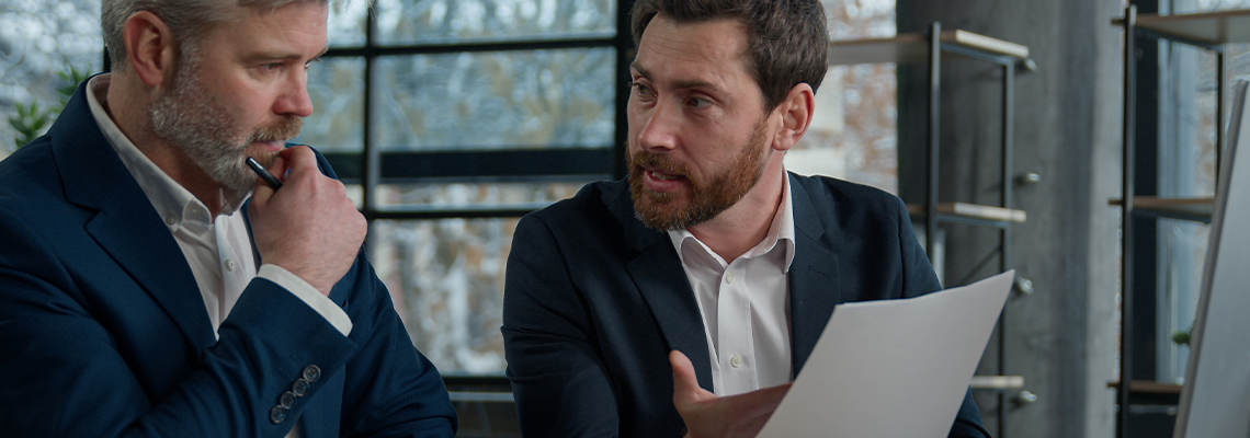 Two disgruntled furious businessmen arguing about bad contract