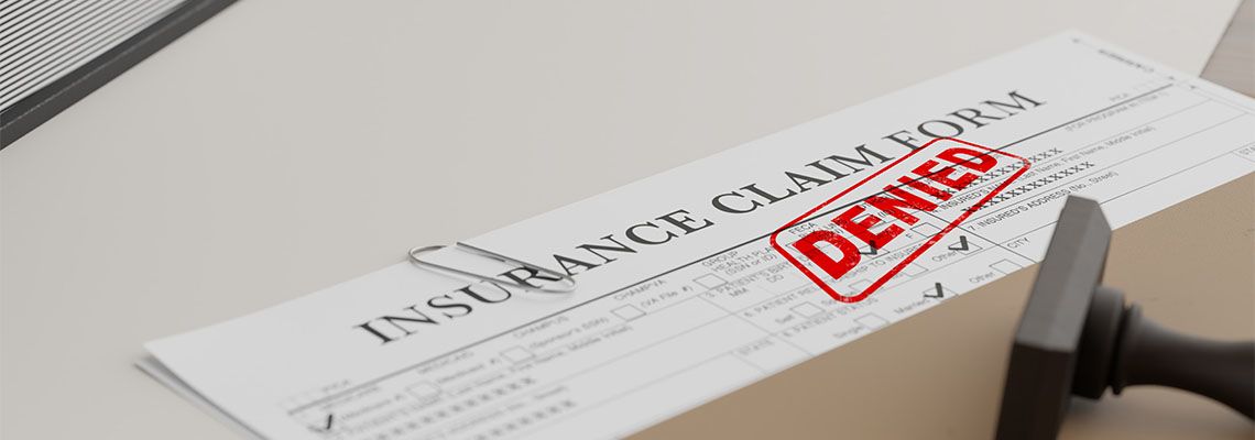 Denied insurance claim form in table