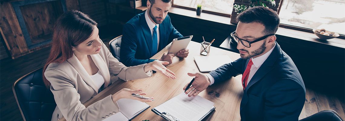 Businessman consulting attorney on legal matters