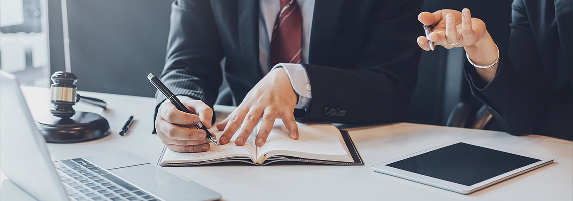 Businessman and lawyer discuss the contract document