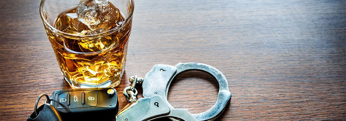 Glass of Alcohol, Car Key and Handcuff