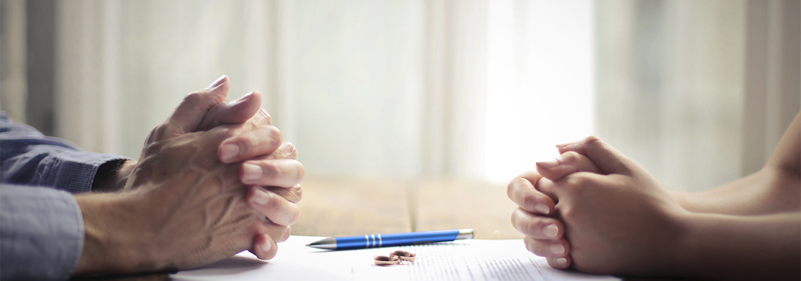 Divorce Paper in front of Wife and Husband