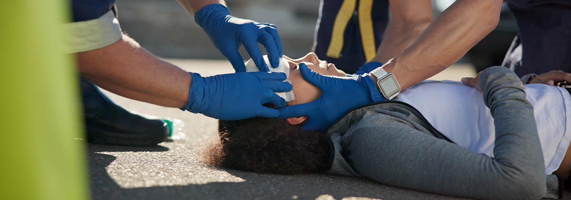 Paramedic, accident and hands on head injury