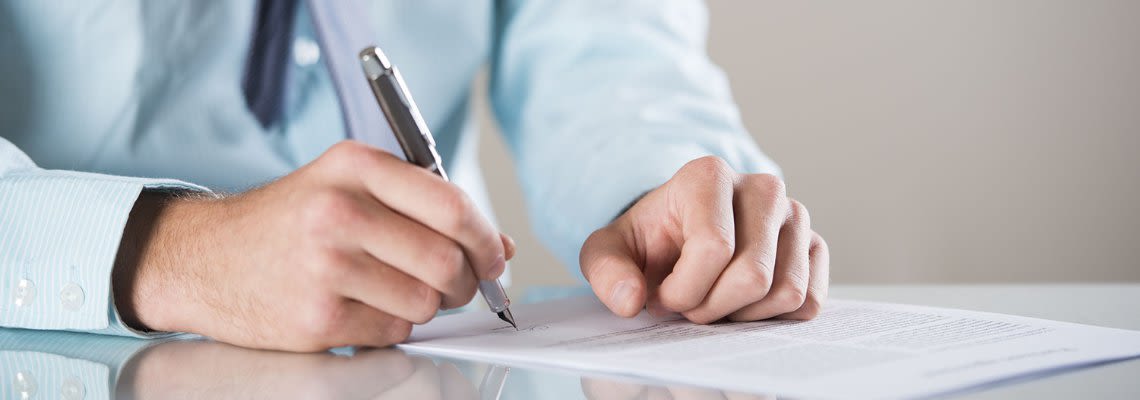 Attorney signing a document