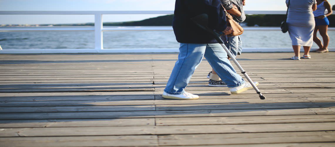 Person Walking with a Crutch