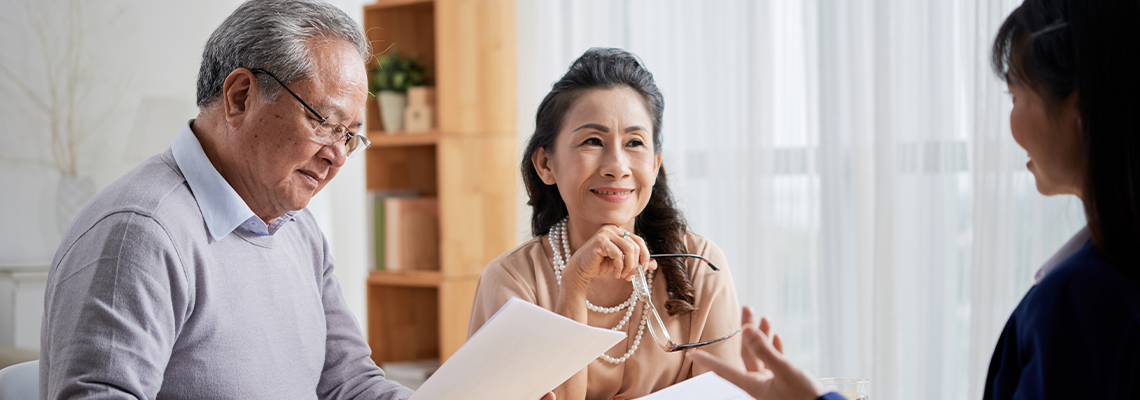 Older couple consulting with estate lawyer