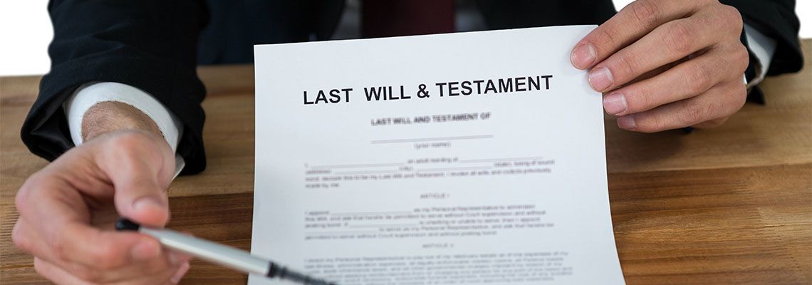 Lawyer holding last will and testament document