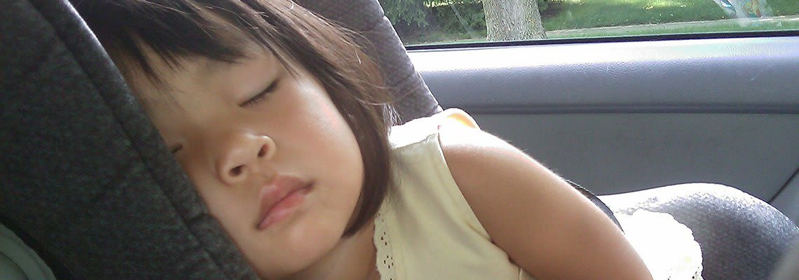 Child sleeping in car seat